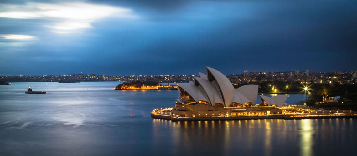 Sydney Harbor and Sydney Opera House lit up at night
