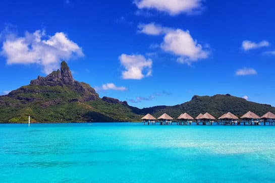 Tropical island waters with huts