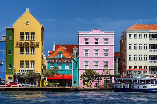 Colorful houses line the waterfront.