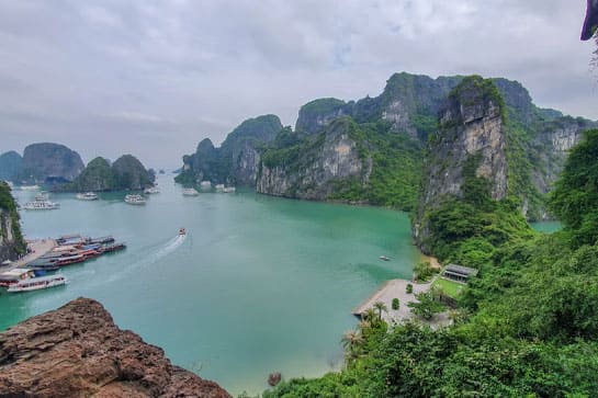 Green water and boats of Ha Long Bay aerial view