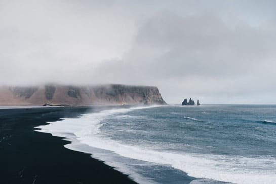 Icelandic black sand beach and mountain in the mist